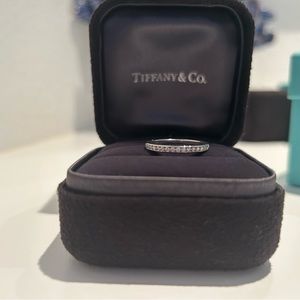 Tiffany & Co. Platinum and diamond half circle band ring. Total .17 ct